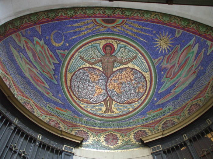 A classically styled mosaic is above the entryway at 75 Broad Street, the former International Telephone and Telegraph headquarters.