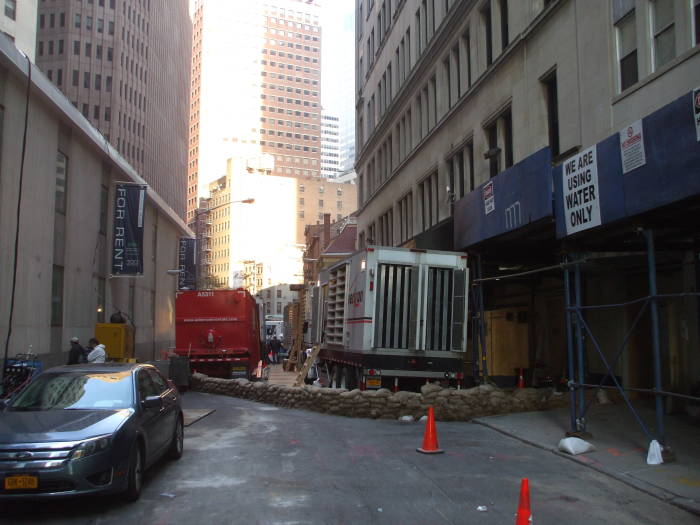 A row of sandbags surrounds emergency telecommunications equipment in the Financial District.