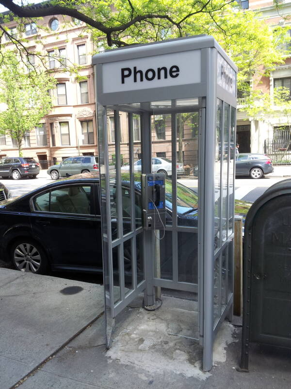 'Superman-style' full-height phone booth, one of the last 4 in Manhattan, at West End Avenue and 90th Street.