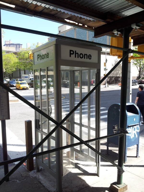 'Superman-style' full-height phone booth, one of the last 4 in Manhattan, at West End Avenue and 66th Street.