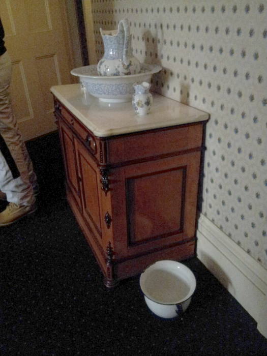 Water basin, pitcher, and chamber pot in the master bedroom within Theodore Roosevelt's birthplace in New York.
