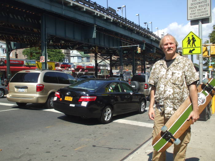 Preparing to ride a longboard the length of Manhattan.