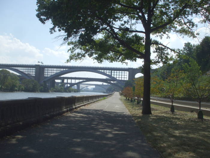 Washington Bridge and the I-95 bridge over Roberto Clemente State Park and the Harlem River bike path.