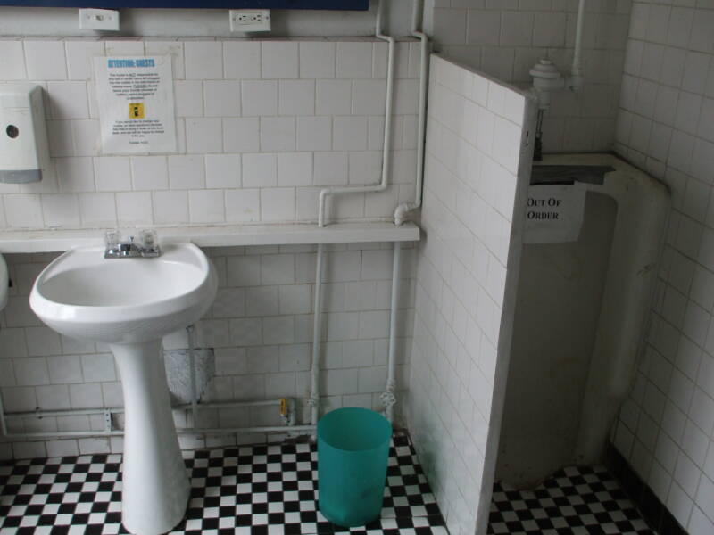 Sinks and large old urinals at the Whitehouse.