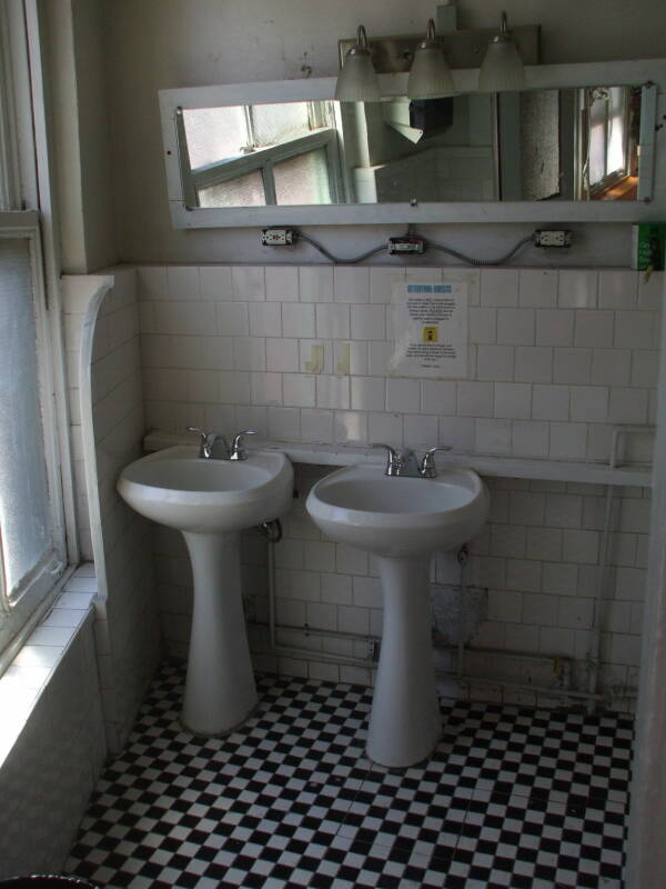 Sinks and large old urinals at the Whitehouse.