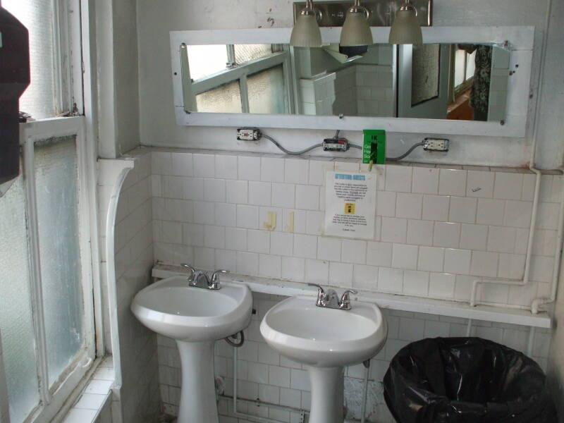 Sinks and large old urinals at the Whitehouse.