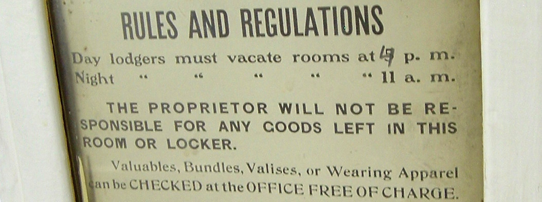 Vintage sign listing regulations of the White House men's SRO hotel in the Bowery.