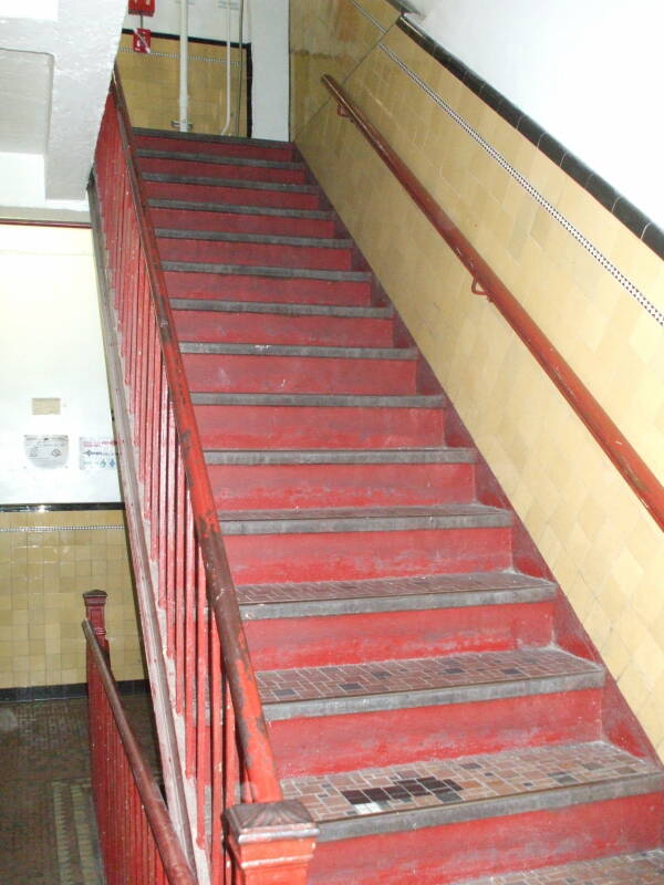 Going upstairs in the Whitehouse SRO hotel and hostel.