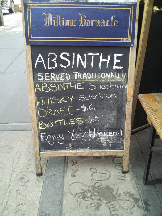 Absinth sign along south side of St. Marks Place between 2nd Avenue and 1st Avenue in the East Village.