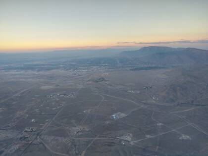 Sandia National Laboratory and the city of Albuquerque seen from the air in the evening.