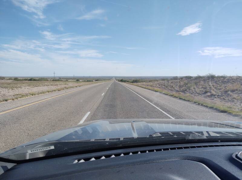 View out the windshield driving northeast on US 70 out of Roswell.