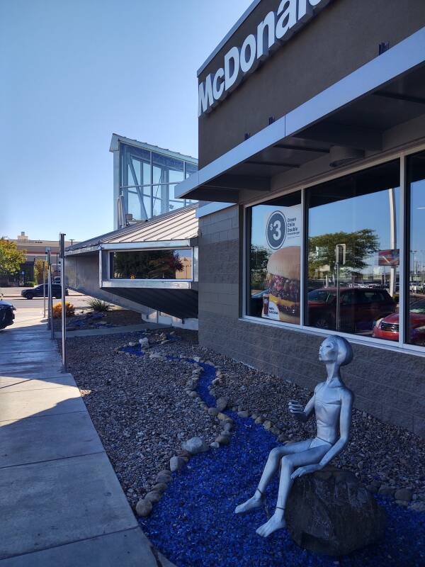 An extraterrestrial figuring sits outside the McDonald's