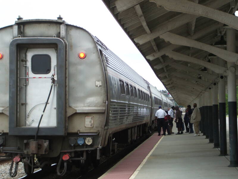 Amtrak train boarding passengers in the afternoon in Fayetteville.