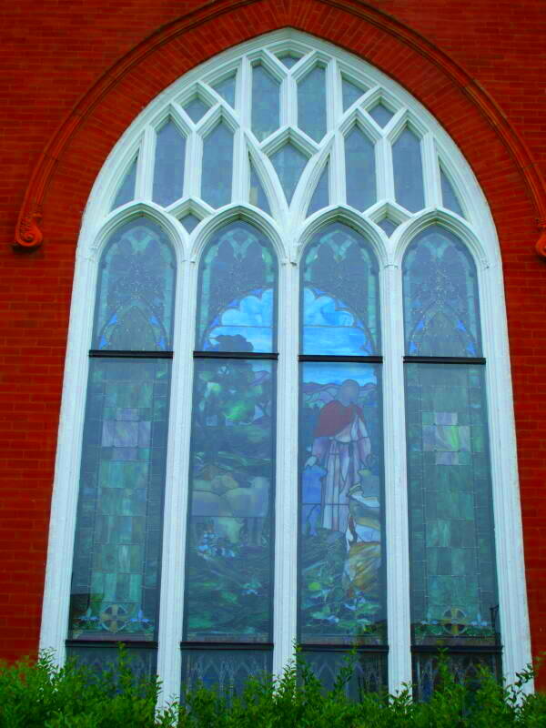 Stained glass window in the United Methodist church in the old downtown of Fayetteville, North Carolina, enhanced with ImageMagick -modulate 100,260,100.