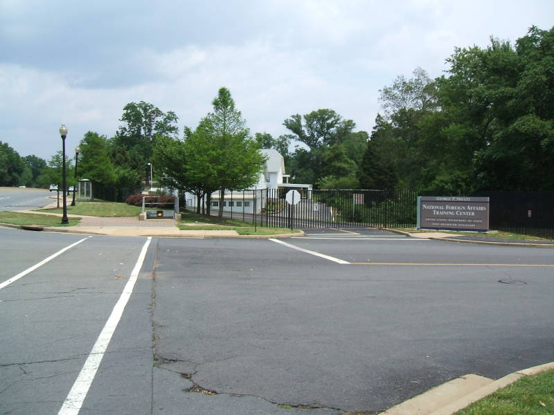 Entrance and sign for the George P Schultz National Foreign Affairs Training Center, a U.S. Department of State training facility at Arlington Hall.