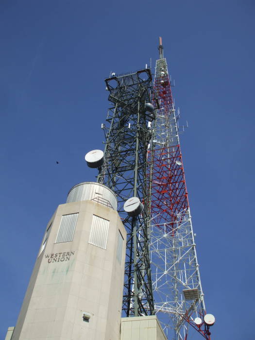 Western Union telegraph and radio relay site in Washington DC with radio towers, microwave dishes, broadcast and two-way radio antennas.