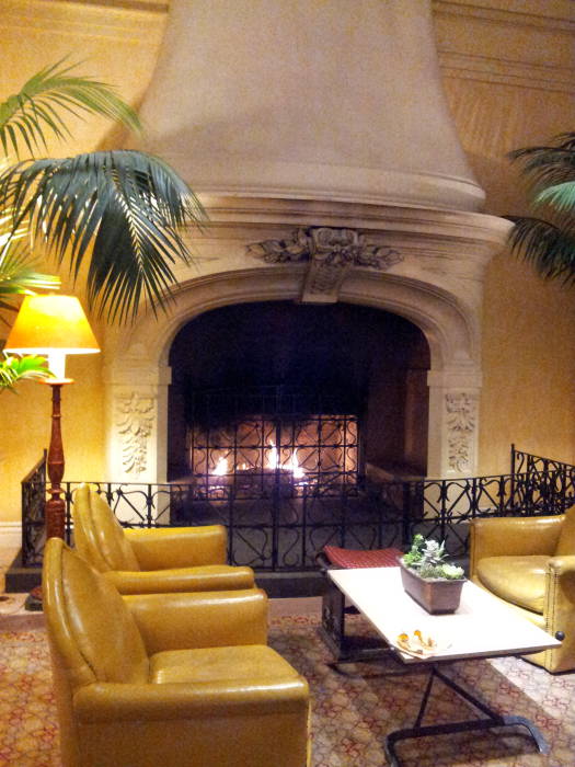 A fire burns in the fireplace in the lobby of the Hotel Belvedere.