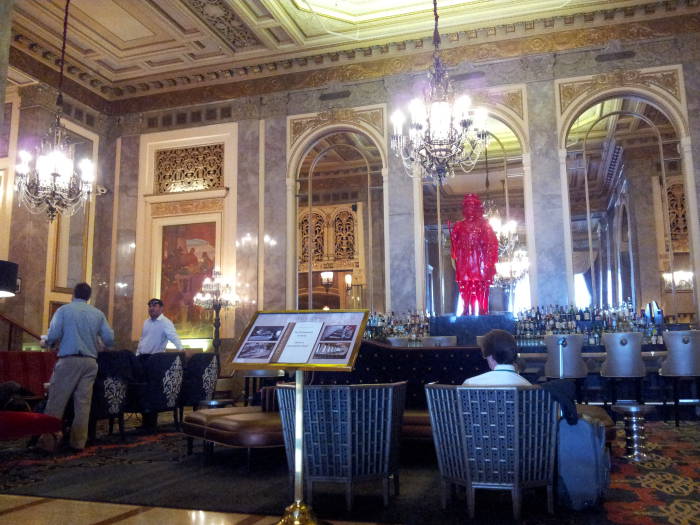 Mirrors and a statue above the bar in the lobby of the Sir Francis Drake Hotel.