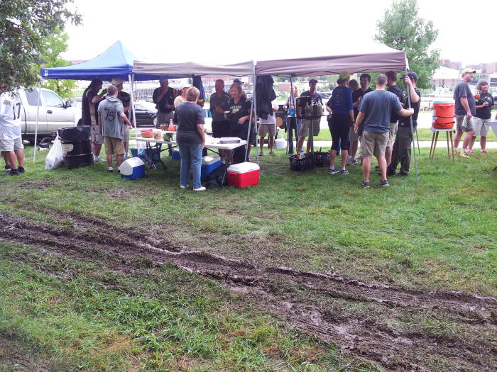 Muddy tracks past the tailgate tent: Purdue West Slayter Hill Tailgate Association, 10 September 2016.